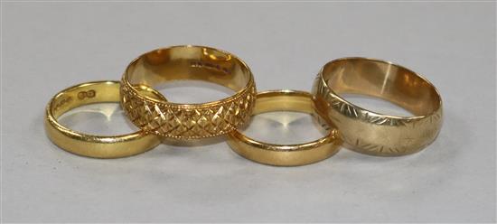 Two 22ct gold bands, an 18ct gold band and a 9ct gold band.